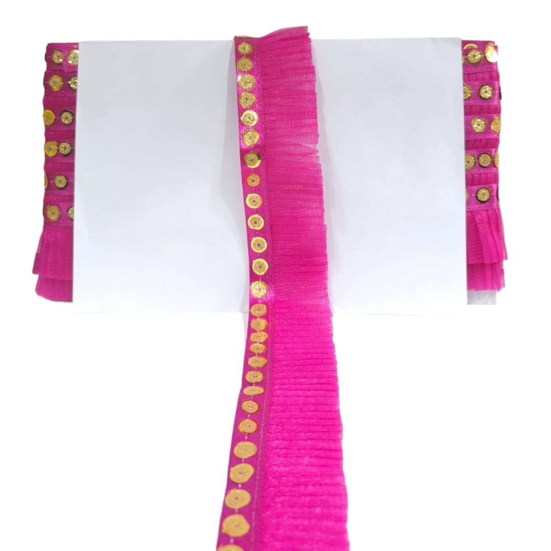 Pink scarf with gold embellishments on a white background
