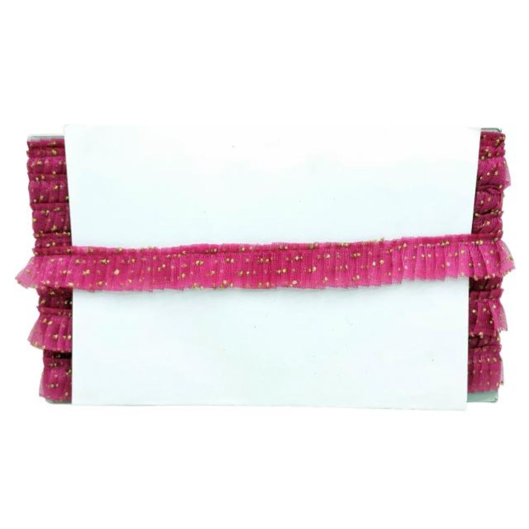 Pink decorative ribbon with gold specks on a white background