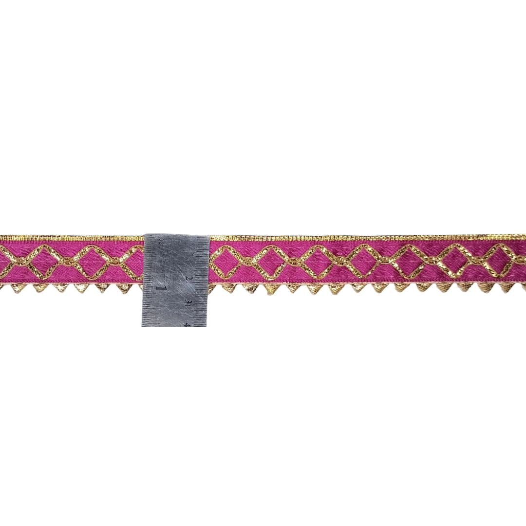 Decorative ribbon with pink and gold pattern on a white background