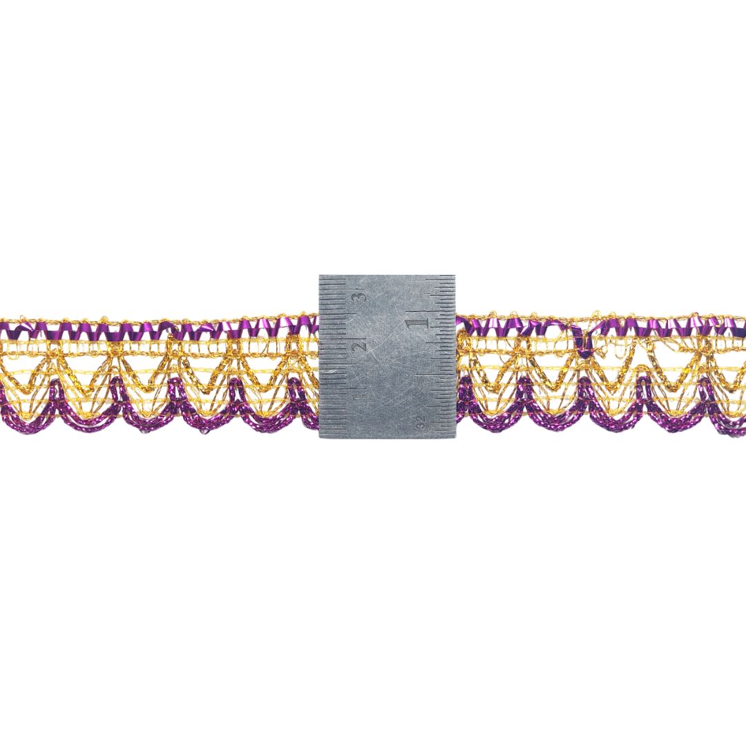 Purple and gold lace trim with a ruler for scale on a white background