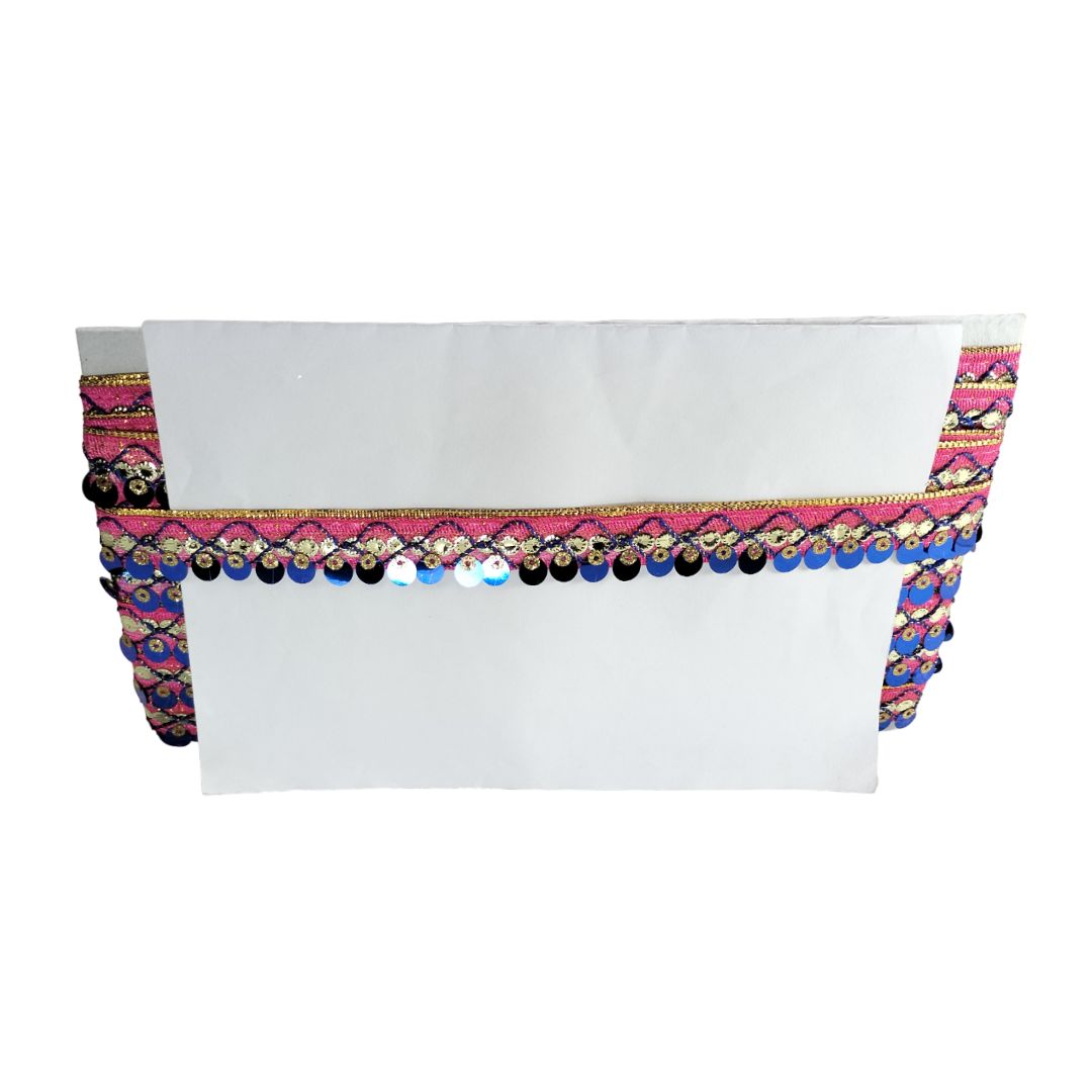 White top with colorful sequin trim on a white background