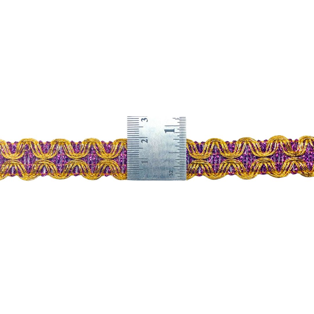 Purple and gold decorative trim with a ruler for scale on a white background