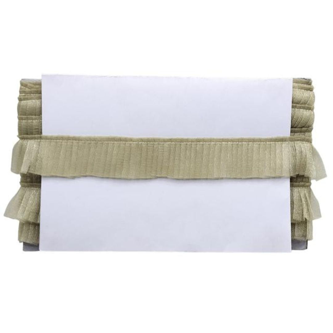 Folded fabric with ruffled edges on a white background