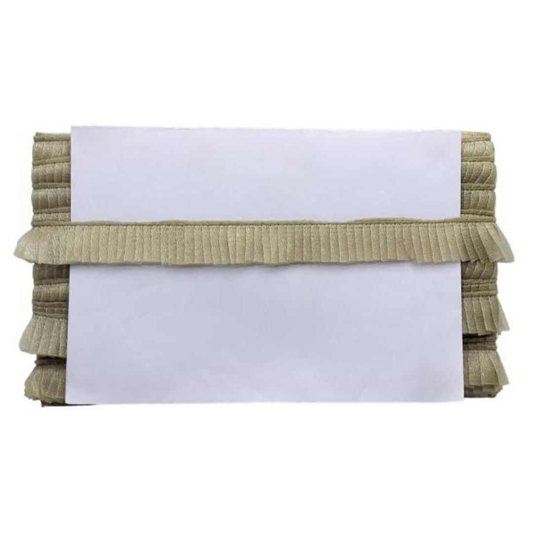 Stack of beige ribbed fabric with a white card on top