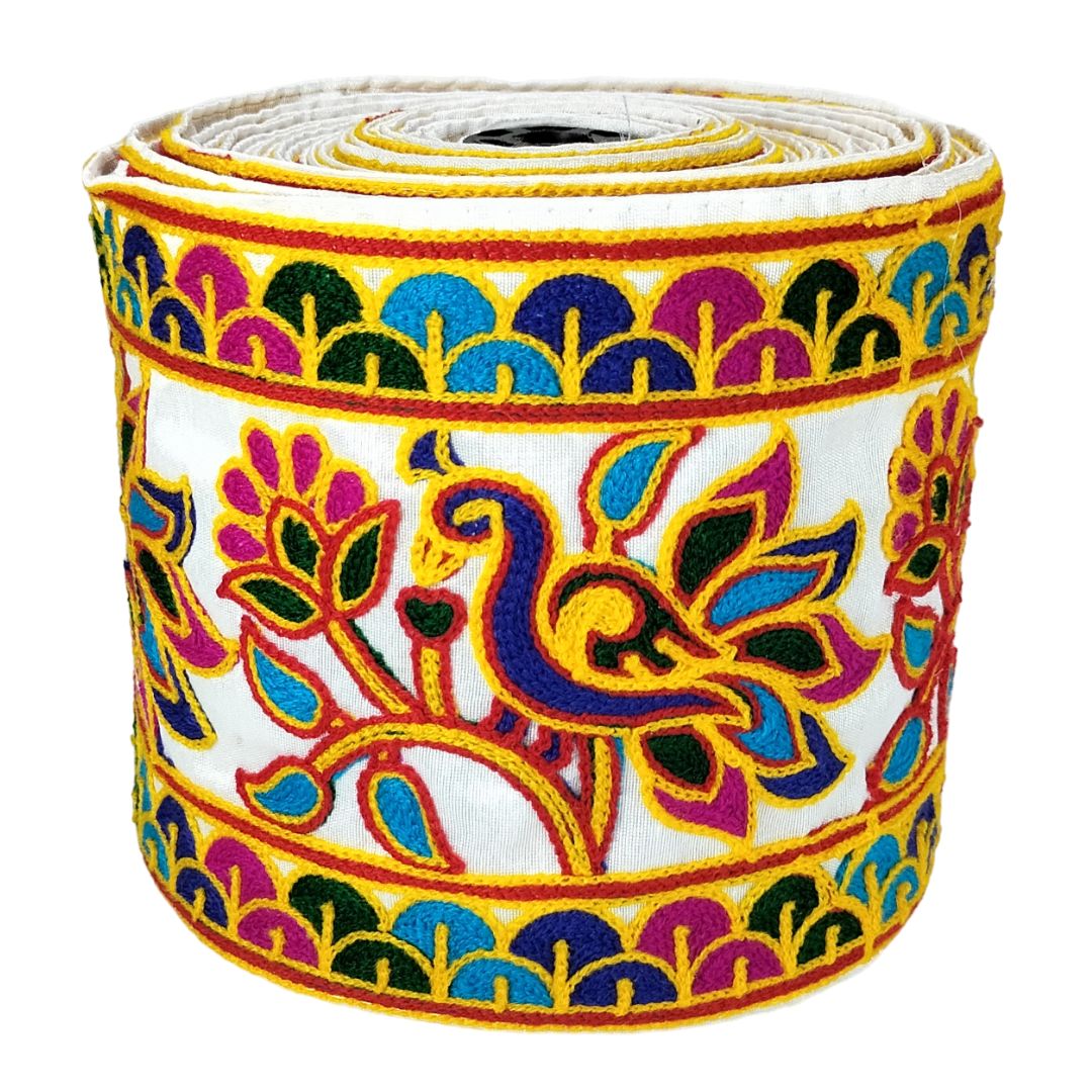 Colorful fabric ribbon with peacock design on a white background