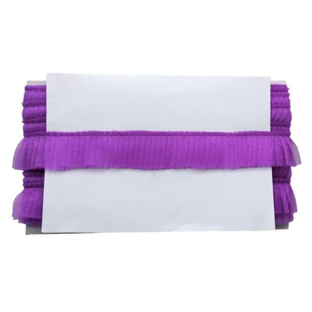 Purple ribbons with a white card on a white background