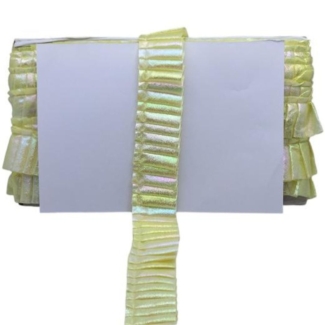 Light green fabric with ruffled edges on a white background