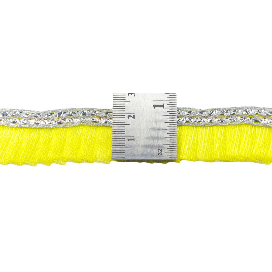 Close-up of a yellow braid with a silver measuring tape on a white background