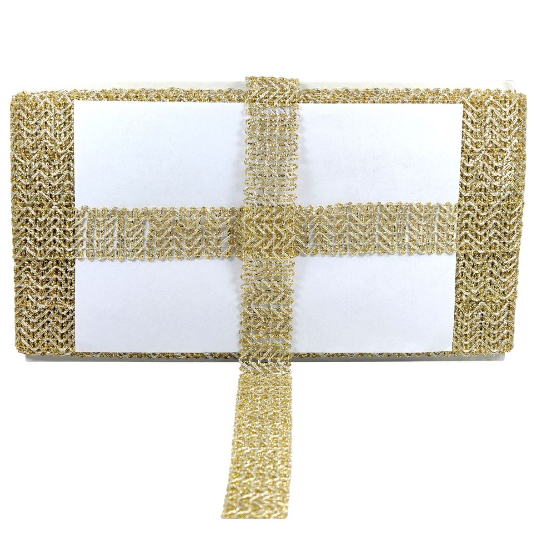 Gold woven clutch bag with a white interior on a white background