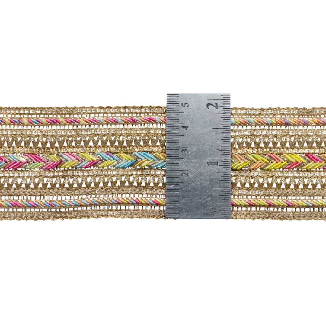 Multicolored patterned ribbon with a ruler for scale on a white background