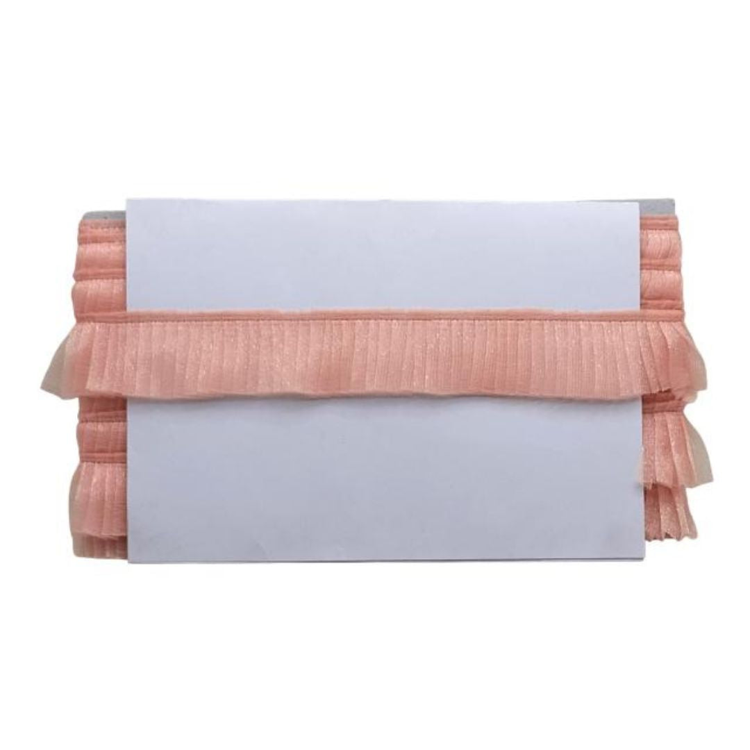 Pink textured clutch bag on a white background