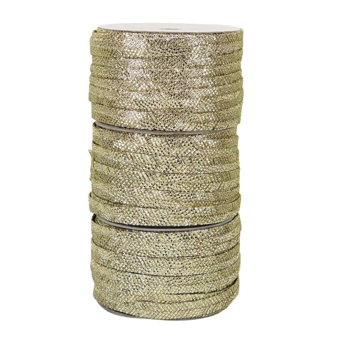 Spool of gold glitter ribbon on a white background