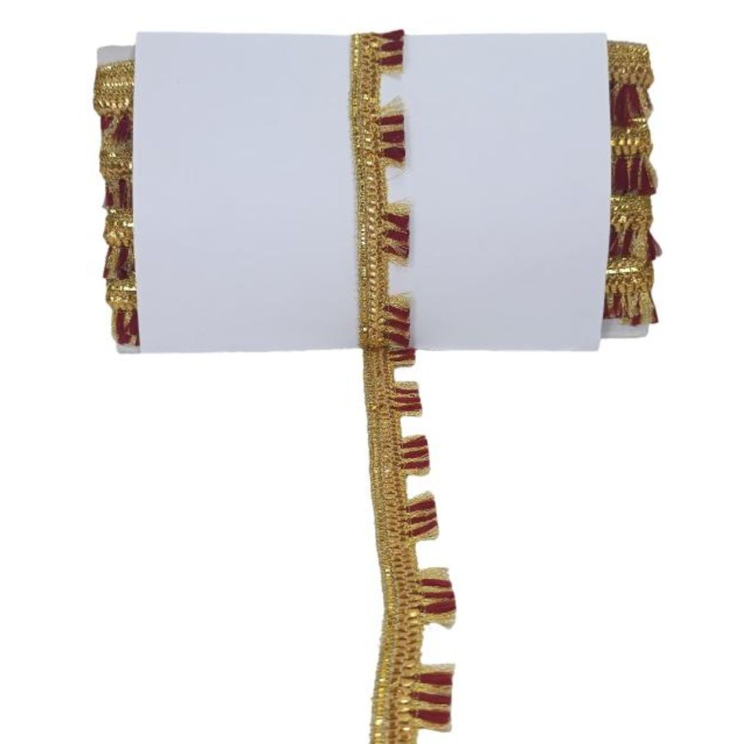 Decorative gold and red trim on a white background