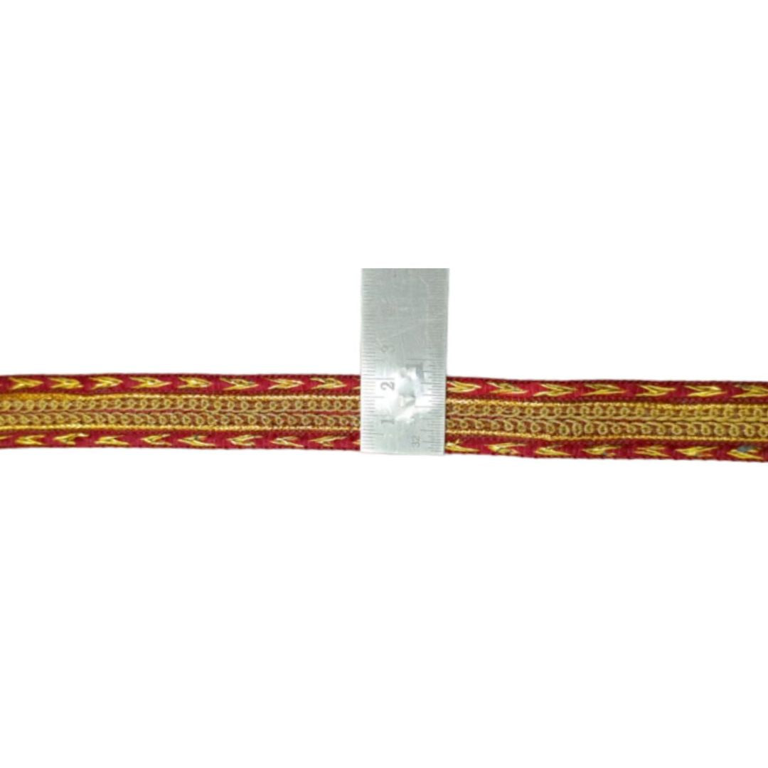 Bracelet with red and gold pattern on a white background