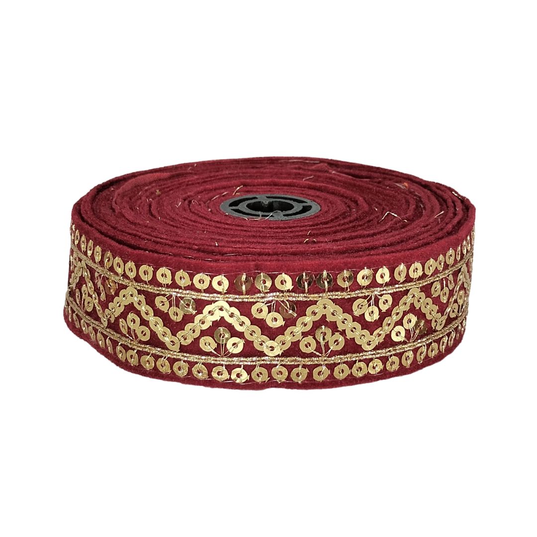 Red ribbon with gold embroidery on a white background