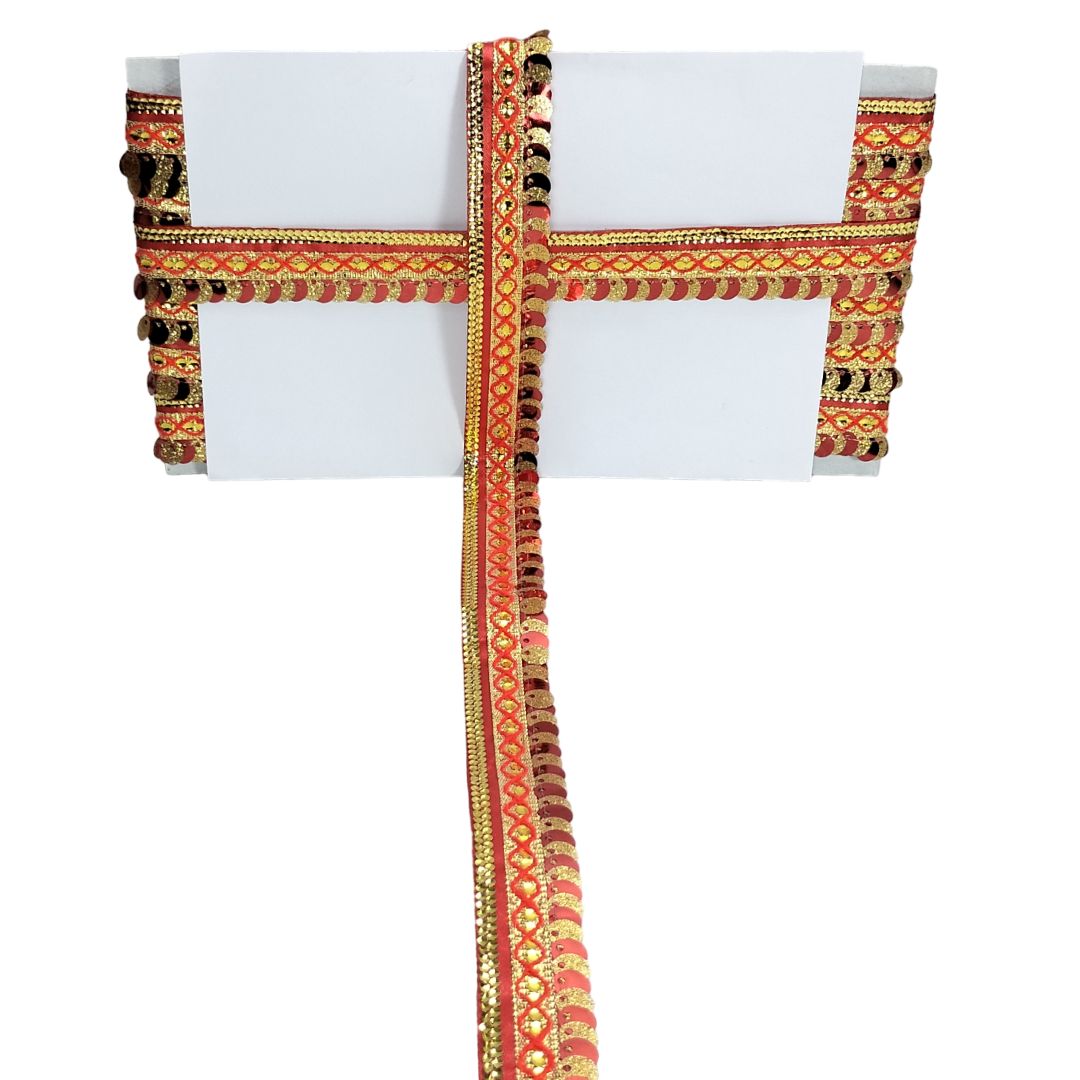 Decorative chair cover with intricate gold and red pattern on a white background