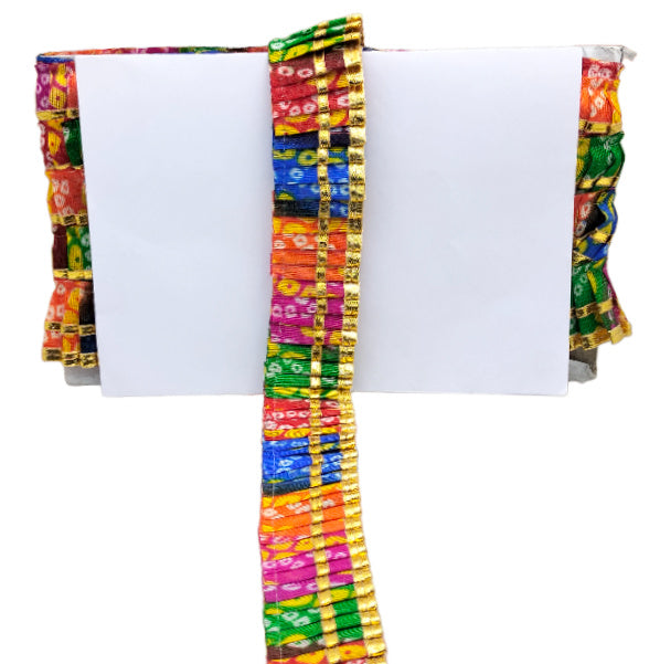 Colorful patterned fabric with a white center on a white background