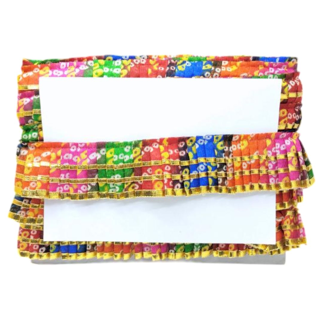 Colorful fabric with a pattern of small squares in various colors on a white background