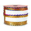 Spool of decorative ribbon with gold, blue, and pink pattern on a white background