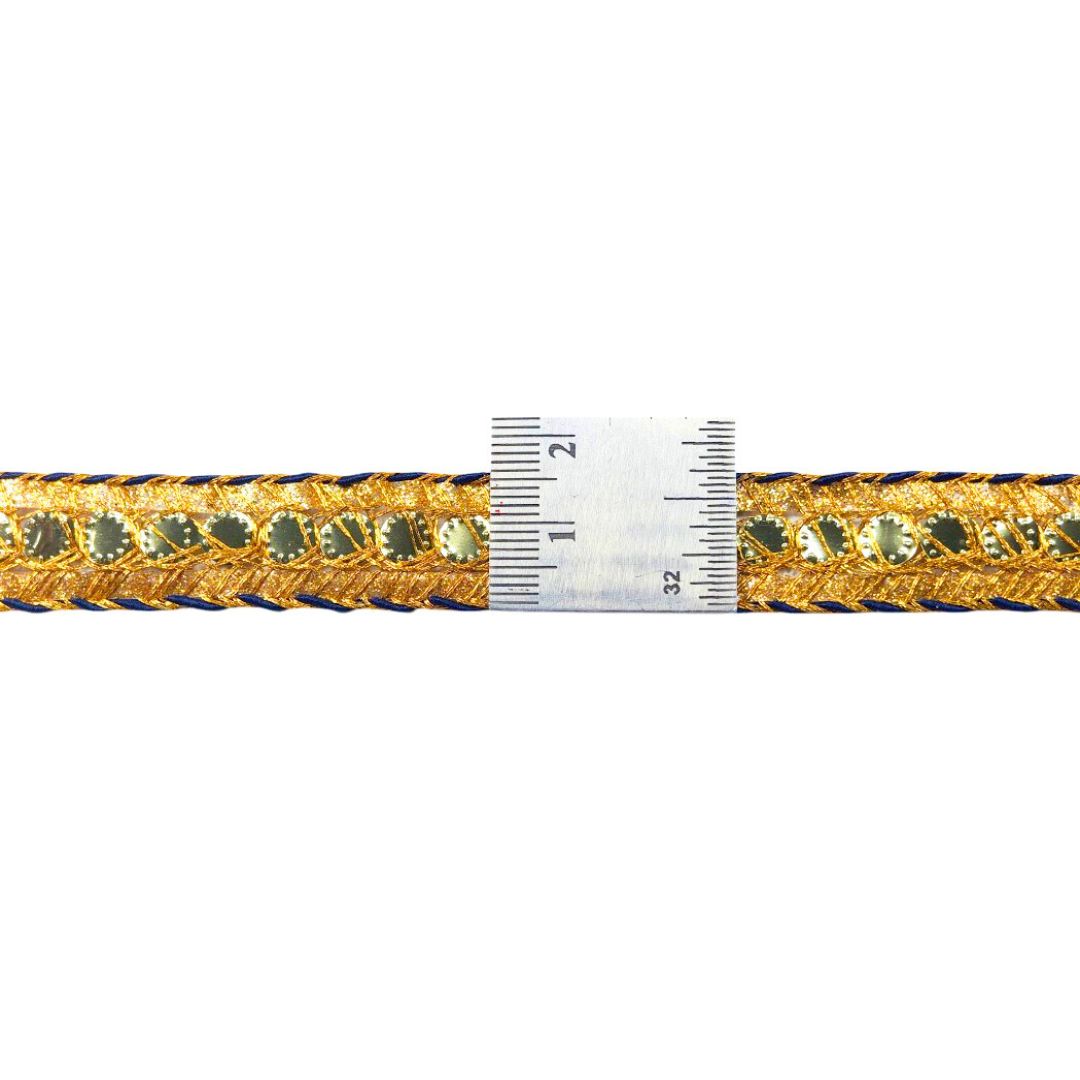 Gold and blue braided cord with a ruler for scale on a white background