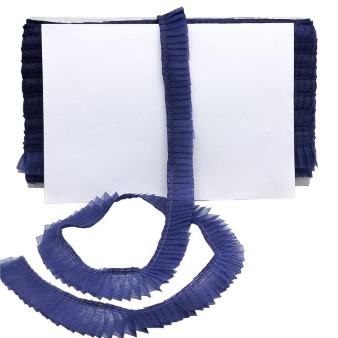 Blue pleated ribbon with a white card on a white background