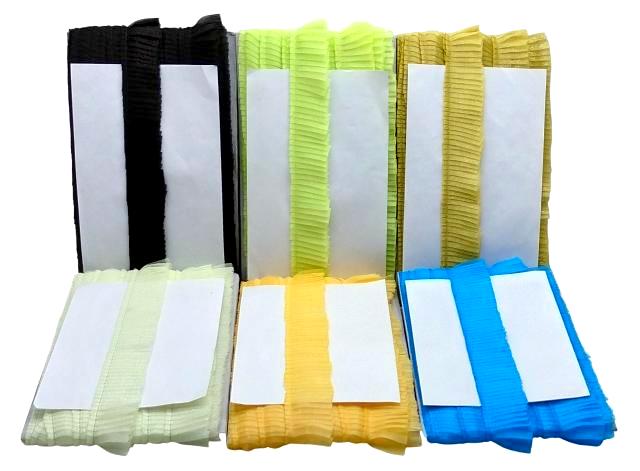 Set of colorful paper bags with white labels on a white background