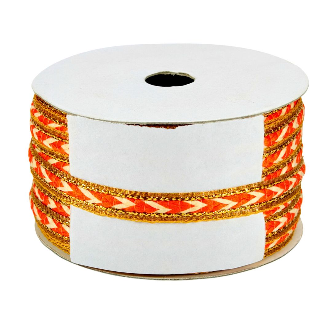 Spool of ribbon with orange and gold pattern on a white background