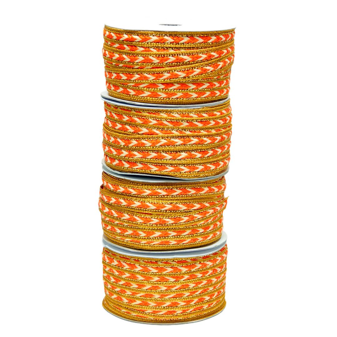 Stack of orange and gold bangles on a white background