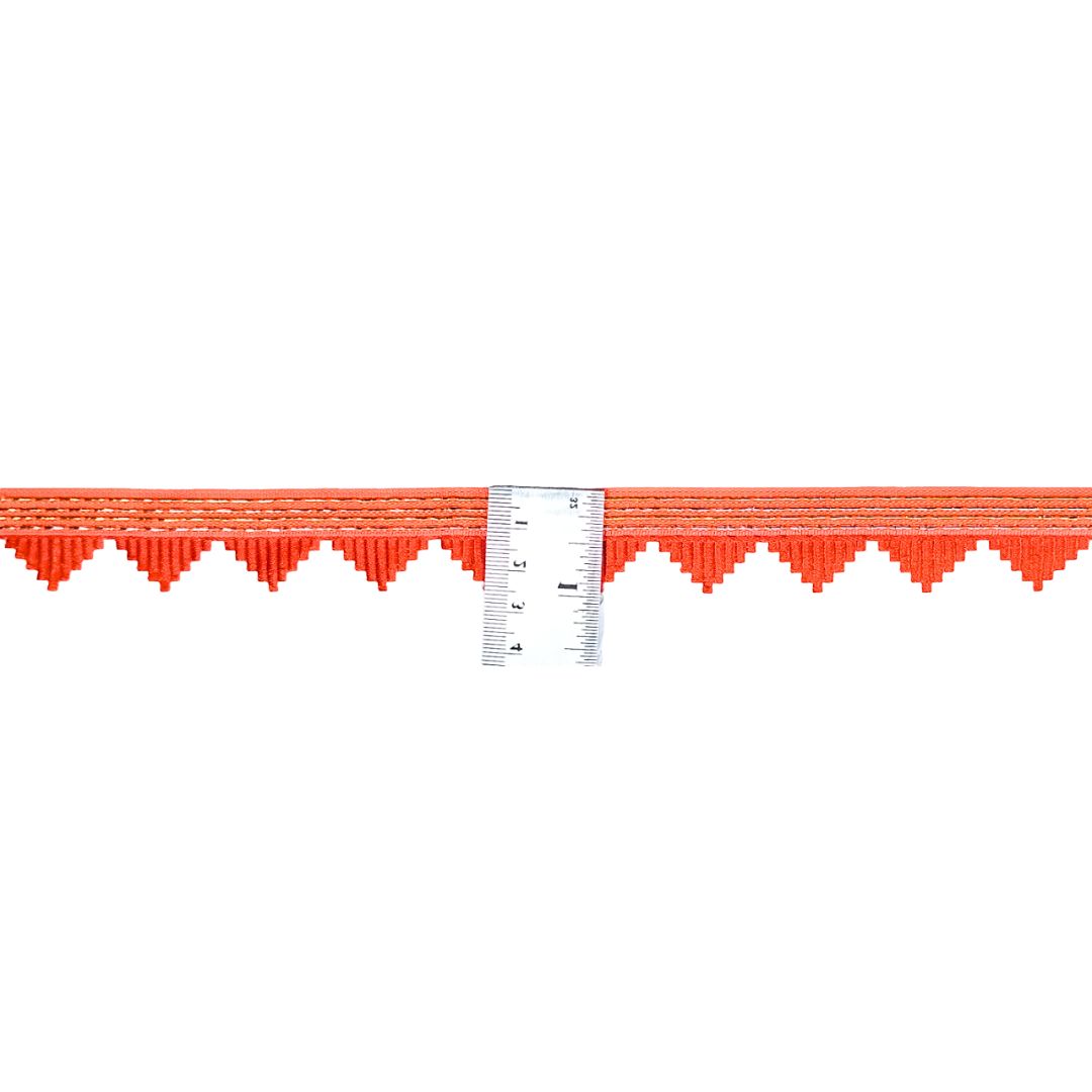 Red plastic border strip with a ruler for measurement on a white background