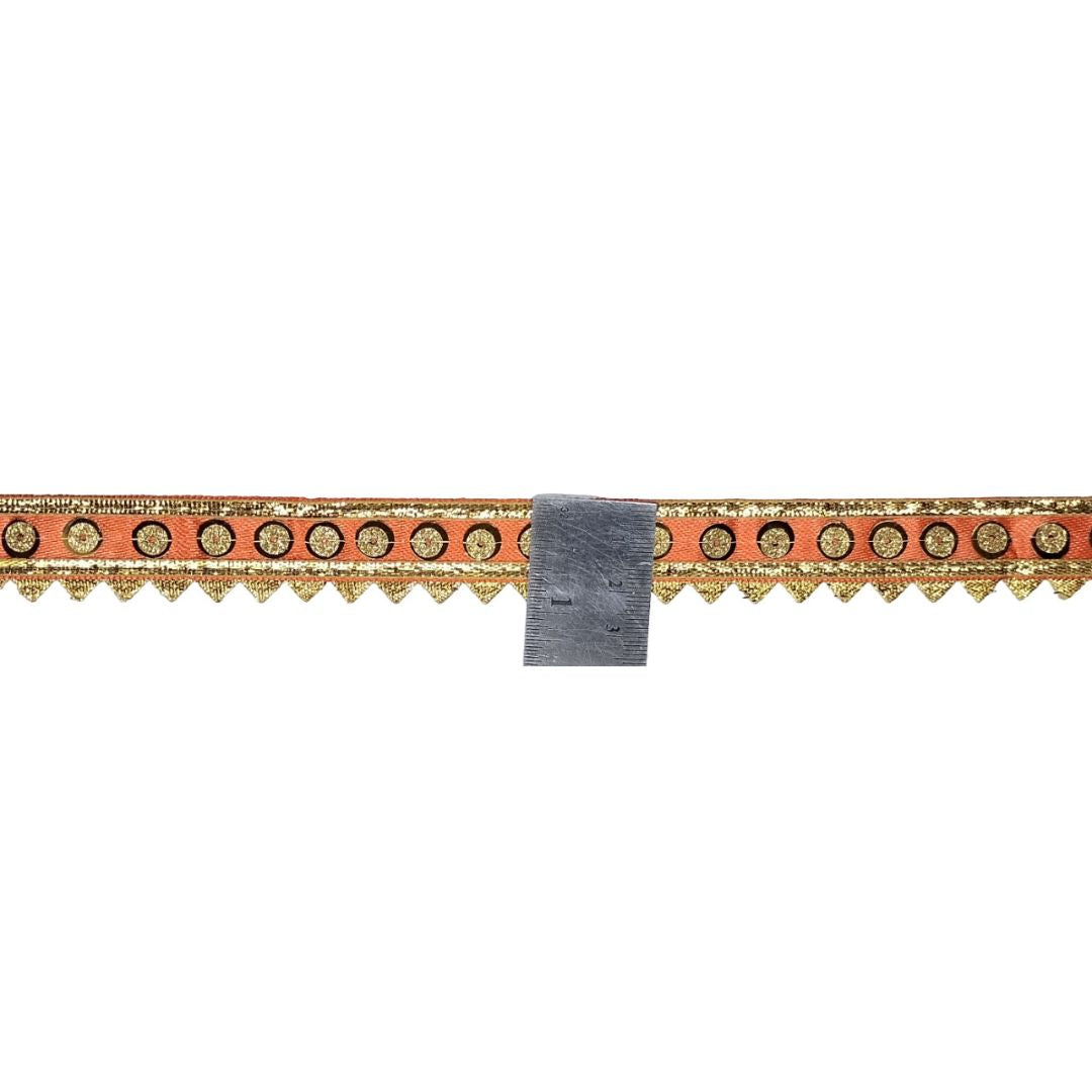 Decorative border strip with gold and orange pattern on a white background