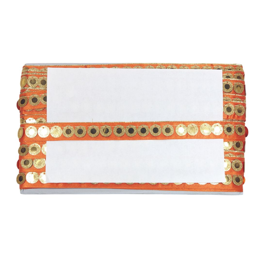 Clutch bag with orange and gold sequin details on a white background