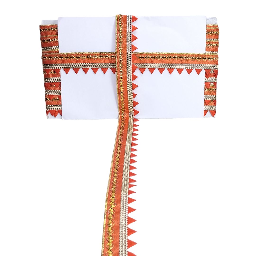 White fabric with orange and gold decorative border on a white background