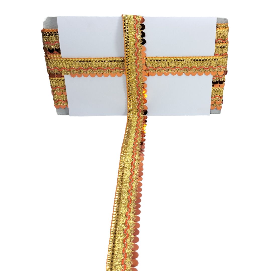 Decorative gold and orange ribbon on a white background