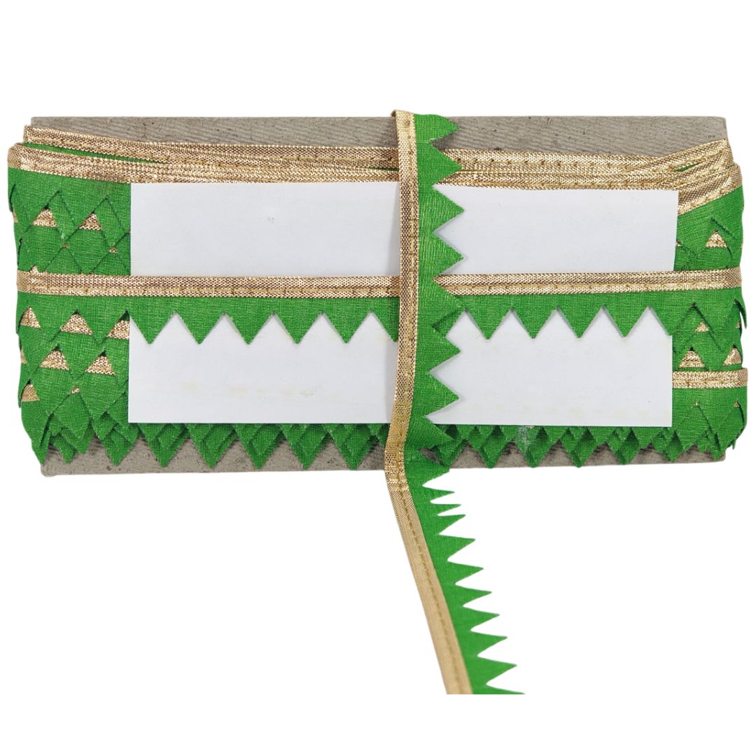 Green and gold decorative ribbon with white label on a white background