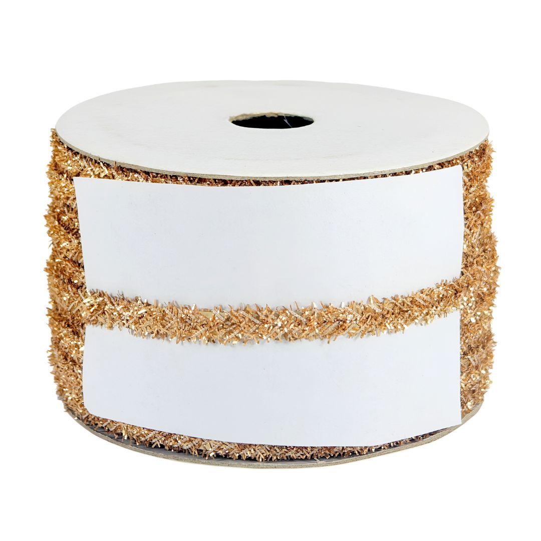 Spool of white ribbon with gold glitter edge on a white background