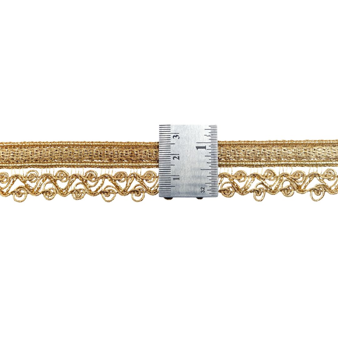 Gold lace trim with a ruler for measurement on a white background