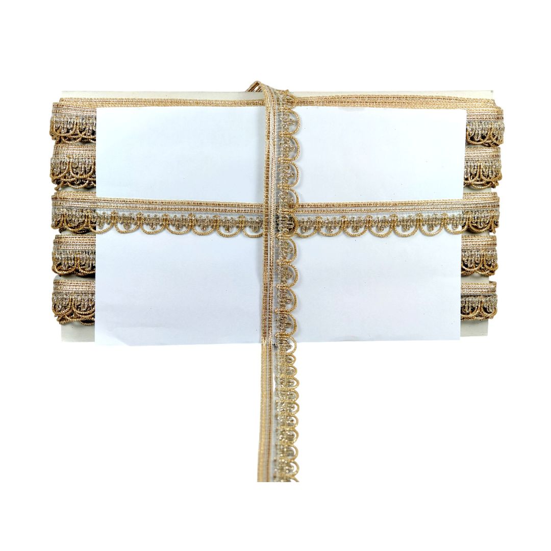 Decorative table runner with gold lace on a white background