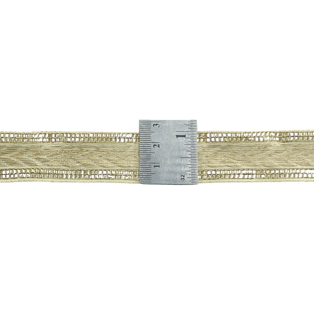 Gold lace trim with a ruler for scale on a white background