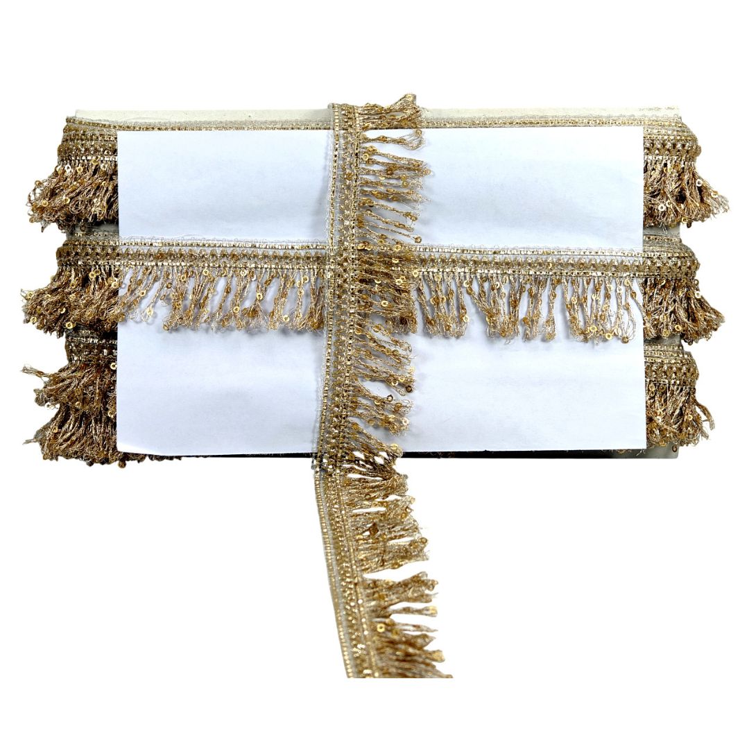 Gold fringe table runner on a white background