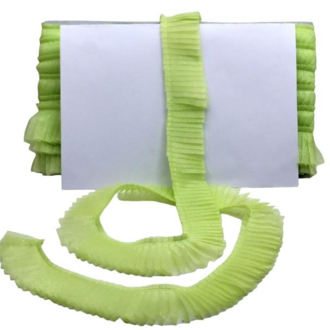Green ribbons with a white card on a white background