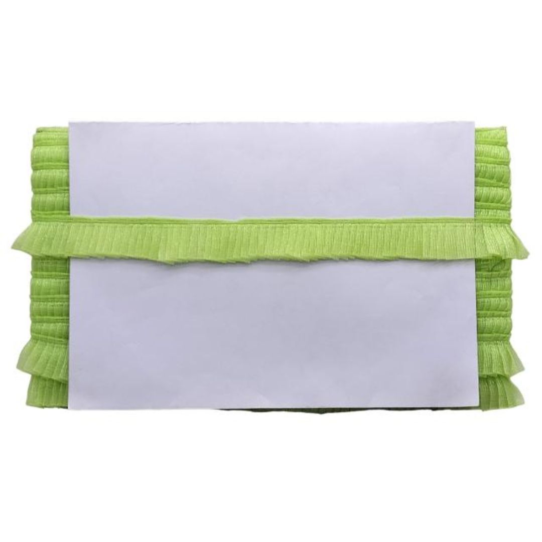 Green ruffled clutch bag on a white background