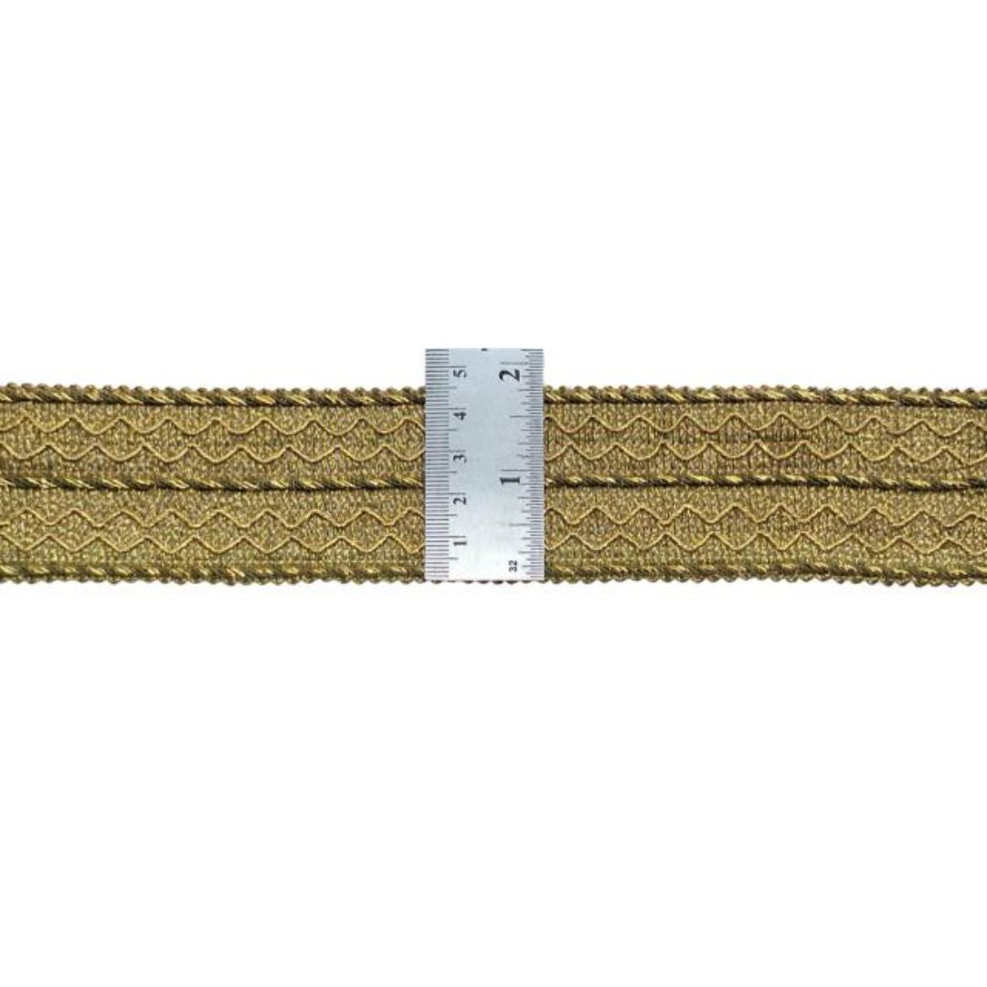 Gold belt with a ruler for size reference on a white background
