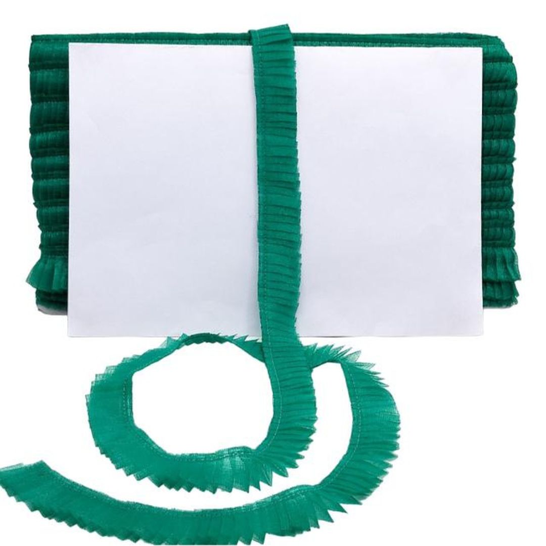 Green ribbons with a white card on a white background