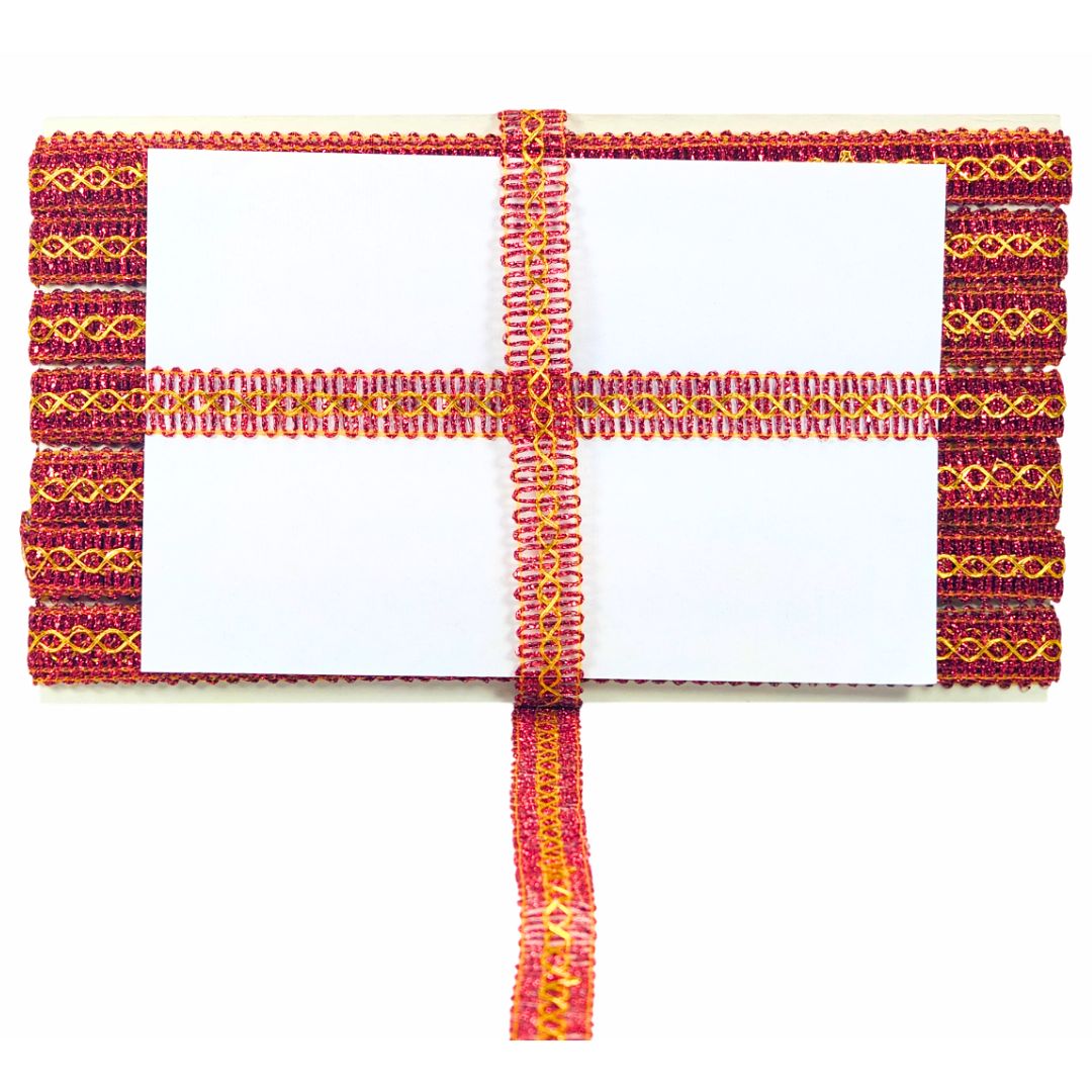 Decorative headband with red and yellow patterns on a white background