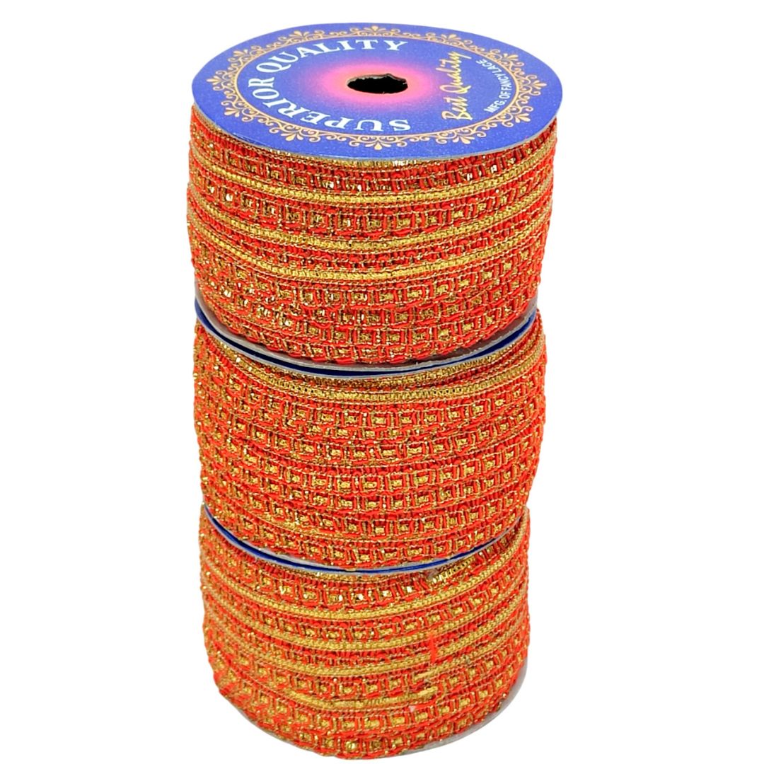 Stack of orange and gold ribbons with a blue label on a white background