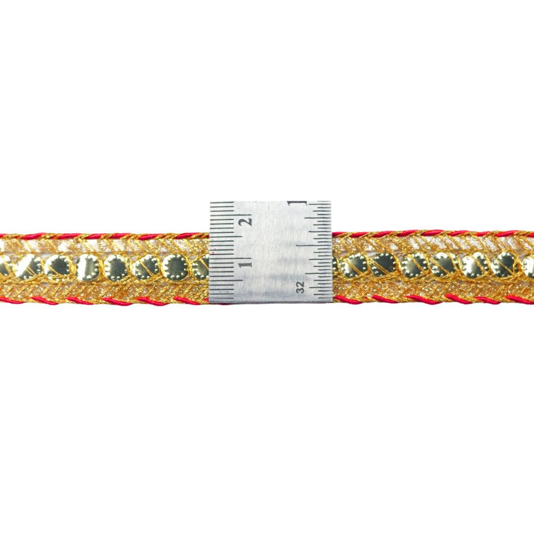 Gold and red ribbon with a measuring tape on a white background