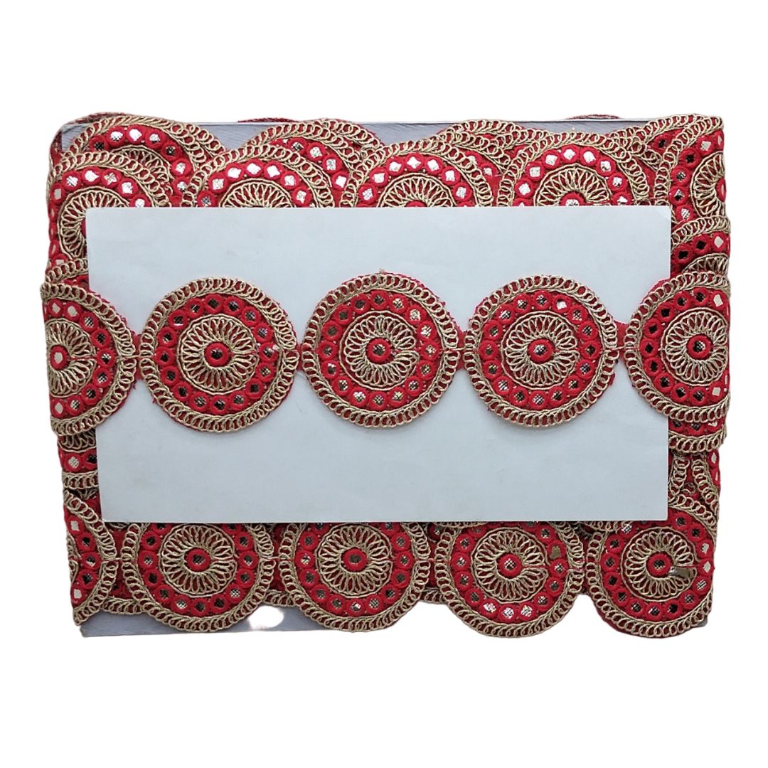 Decorative clutch with red and gold patterns on a white background