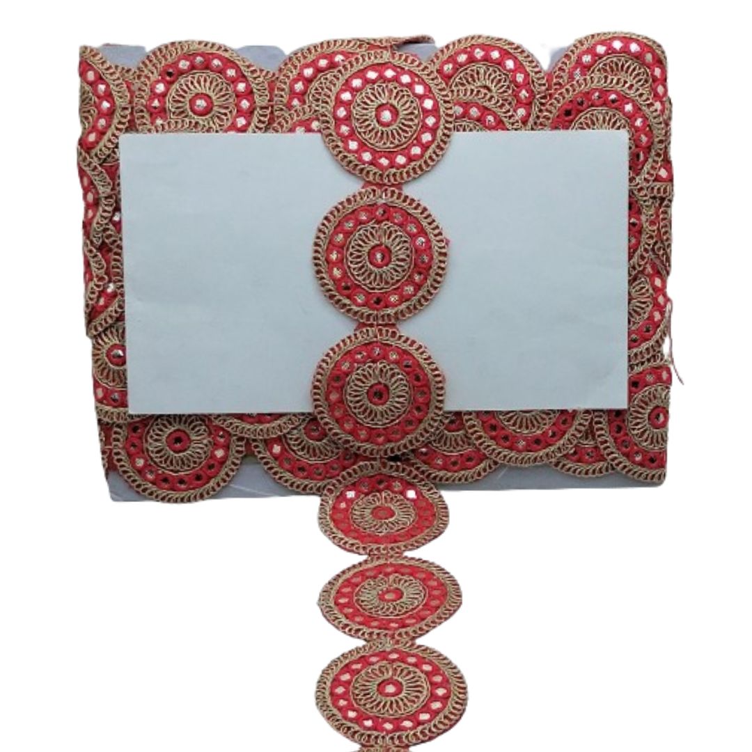 Decorative clutch with red and gold patterns on a white background