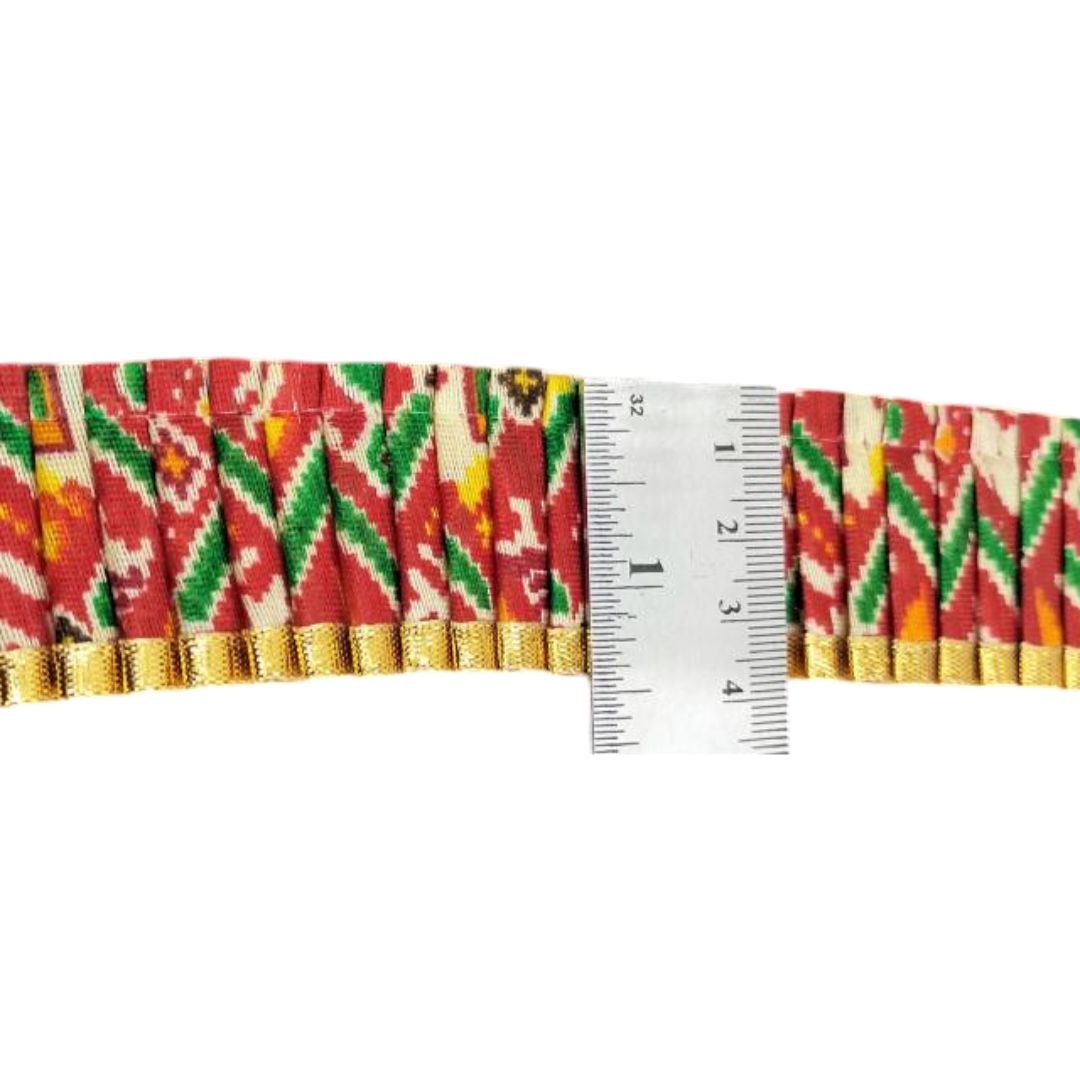 Colorful fabric strip with a ruler for measurement on a white background