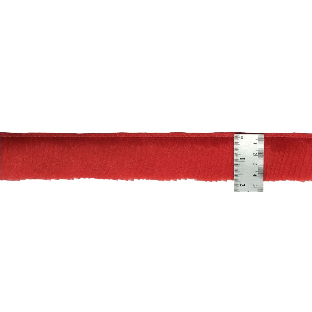 Red fabric with a ruler on a white background
